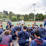 The Sultan High School football team gathers at the end of practice on Aug. 23, 2019, at Sultan High School. (Katie Webber / The Herald)