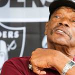 Otis Sistrunk, former NFL defensive lineman, talks with visitors to his tent during the Bill Baker Memorial Steel and Wheel Car Show at Everett Machinists Hall on Aug. 17. (Kevin Clark / The Herald)