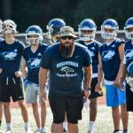 Meadowdales head coach James Harmon watches his team practice at Meadowdale High School on Aug. 22. (Katie Webber / The Herald)