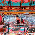 Finishing touches are placed on a ride at the Evergreen State Fairgrounds in Monroe on Aug. 21. (Kevin Clark / The Herald)