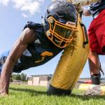 Sebastian Wanjiru runs through a tackling drill during practice at Mariner High School in Everett on Aug. 22. (Kevin Clark / The Herald)