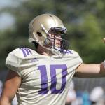 Washington quarterback Jacob Eason, a Lake Stevens graduate, motions to a teammate during a practice on Aug. 6, 2019, in Seattle. (AP Photo/Elaine Thompson)