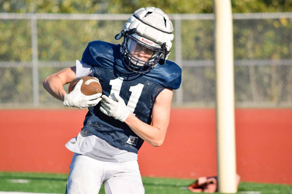 Sophomore Jadon Claps catches the ball during wide receiver drills on Aug. 27, 2019, at Glacier Peak High School in Snohomish. (Katie Webber / The Herald)