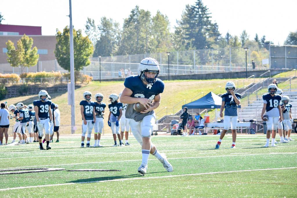 Junior Ryan Black catches the ball during football practice on Aug. 27, 2019, at Glacier Peak High School in Snohomish. (Katie Webber / The Herald)