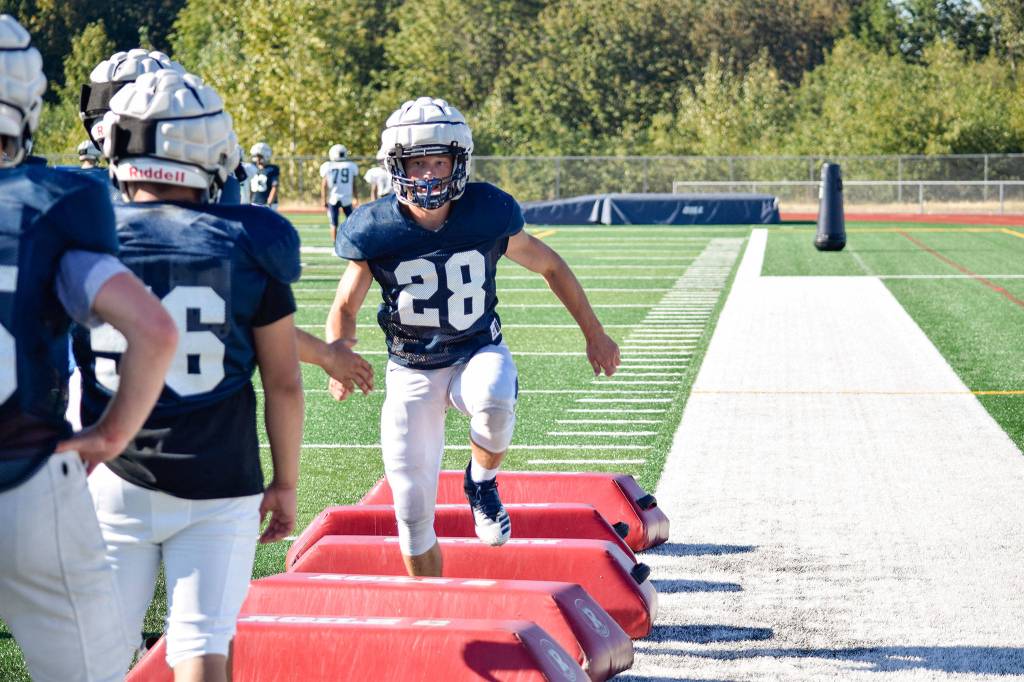 Senior Dylan Owen quickly finishes footwork drills during football practice on Aug. 27, 2019, at Glacier Peak High School in Snohomish. (Katie Webber / The Herald)