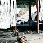 Investigators sifted through the wreckage Wednesday of a two-alarm fire at a former sawmill in Snohomish. (Caleb Hutton / The Herald)