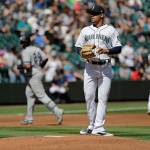 Mariners starting pitcher Justus Sheffield (center) stands on the mound as the Yankees Gary Sanchez (rear) rounds the bases after hitting a two-run home run during the first inning of a game on Aug. 28, 2019, in Seattle. (AP Photo/Ted S. Warren)