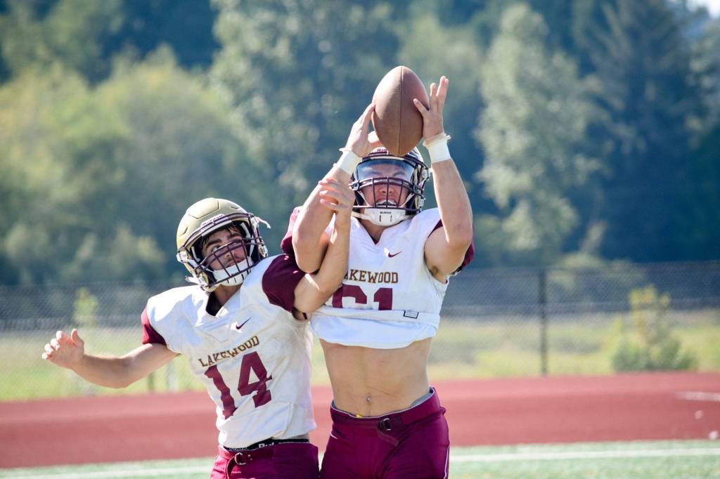 Senior Jared Taylor intercepts the ball while practicing as a cornerback on Aug. 28, 2019, at Lakewood High School in Arlington. (Katie Webber / The Herald)