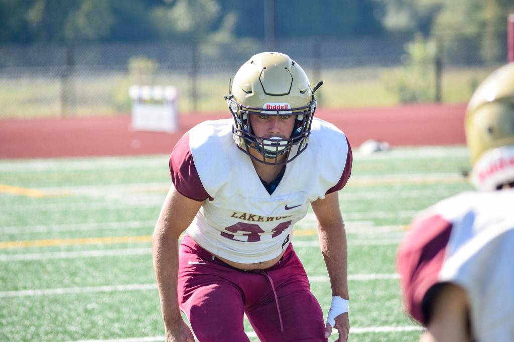 Senior Jackson Schultz waits for the ball to snap while practicing defense on Aug. 28, 2019, at Lakewood High School in Arlington. (Katie Webber / The Herald)