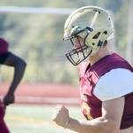 Senior Brandt Starkey sprints to the sidelines during conditioning drills on Aug. 28, 2019, at Lakewood High School in Arlington. (Katie Webber / The Herald)