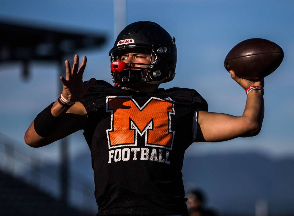 Gio Fregoso throws the ball during football practice at Monroe High School on Wednesday, Aug. 28, 2019 in Monroe, Wash. (Olivia Vanni / The Herald)