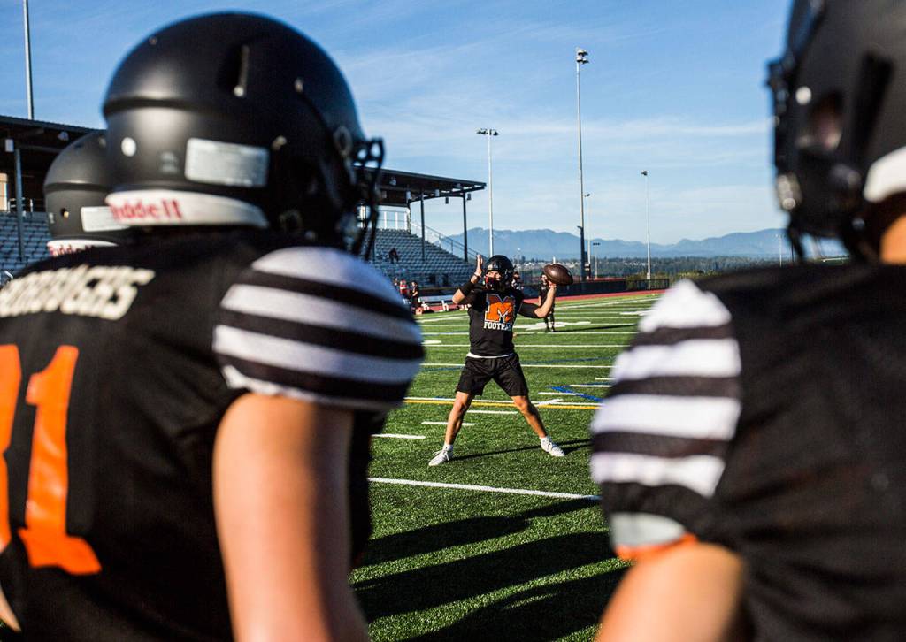 Gio Fregoso throws the ball during football practice at Monroe High School on Wednesday, Aug. 28, 2019 in Monroe, Wash. (Olivia Vanni / The Herald)
