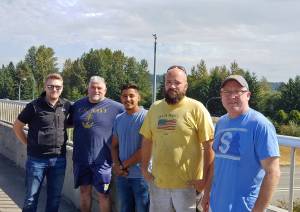 Bothell police say these men saved a man attempting to jump off Highway 527 Saturday morning. (Bothell Police Department)