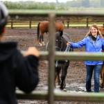 Shelby Janes leads horses for campers during the Warm Beach Horseman Camp in Stanwood on Sept. 8. (Kevin Clark / The Herald)