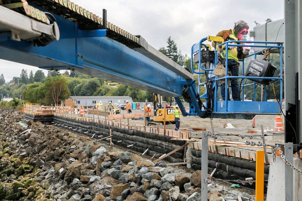 Welders continue work on the new seawall at the terminal Wednesday morning in Mukilteo. (Kevin Clark / The Herald)                                The new seawall (Kevin Clark / The Herald)