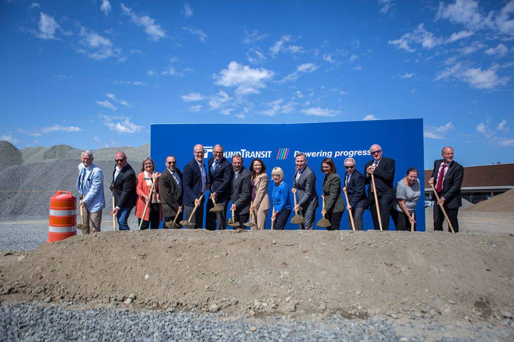 State, county and transit officials line up at the groundbreaking ceremony for the Link light-rail extension on Tuesday in Lynnwood. (Olivia Vanni / The Herald)