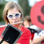 Camlin Vespaz plays her flute during practice Thursday evening at Snohomish High, in preparation for the first football game of the season. (Kevin Clark / The Herald)