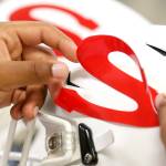 Snohomish S decals are applied to newly cleaned helmets on Aug. 30. (Kevin Clark / The Herald)