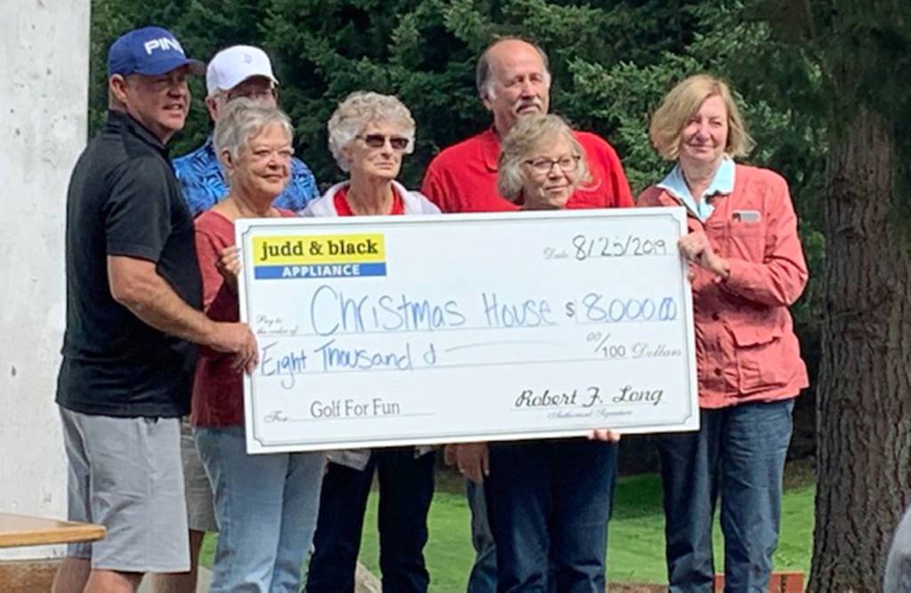 Judd & Black presented an $8,000 check to Christmas House.