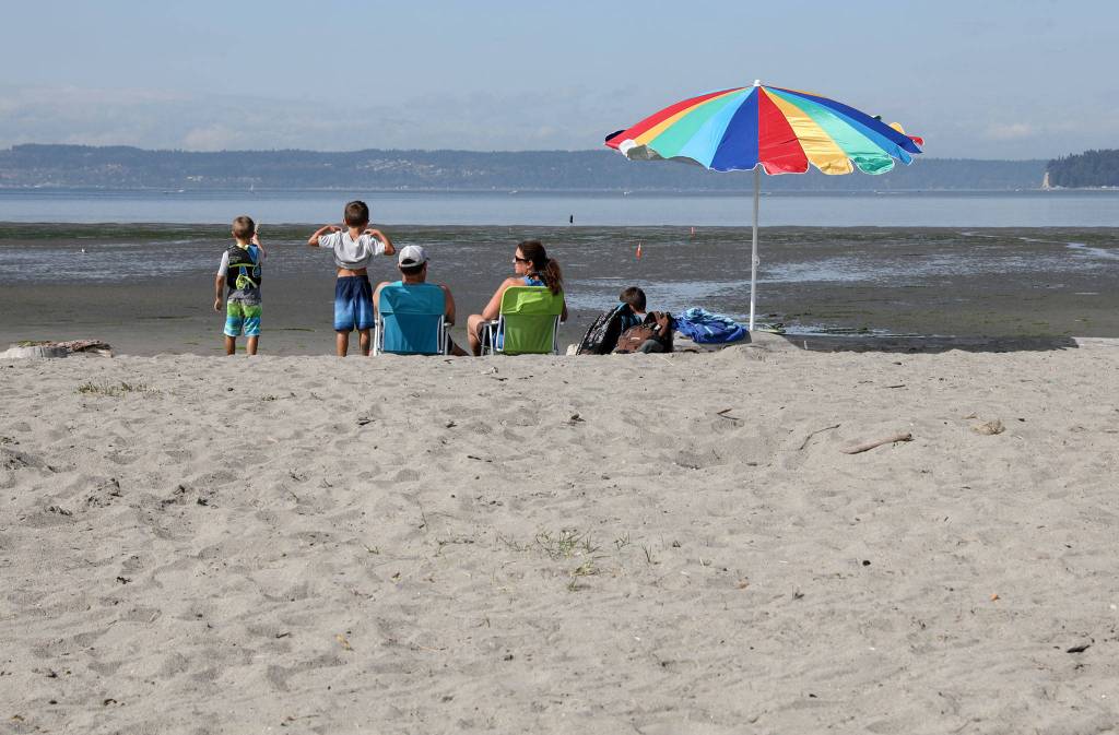 A family takes advantage of the last weekend the Jetty Island ferry operates. (Lizz Giordano / The Herald)