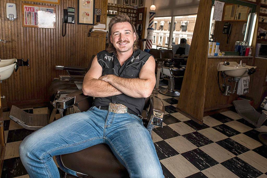Country singer Morgan Wallen poses for a portrait after getting a mullet at Paul Mole Barber Shop in New York. Wallen, who has turned heads with his likable hit song Whiskey Glasses, said he decided to try a mullet after seeing old photos of his dad proudly rocking the hairstyle. (Photo by Charles Sykes/Invision)