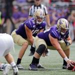 Washingtons Matteo Mele (foreground) replaced Nick Harris at center during the Huskies win over Eastern Washington on Saturday in Seattle. (AP Photo/Elaine Thompson)