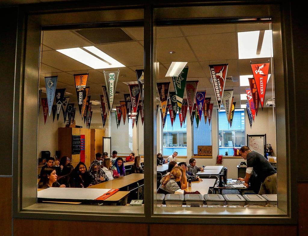 College banners hang from the ceiling in Johnathan Altermotts math and AVID classroom at the newly built North Middle School. (Dan Bates / The Herald)