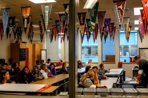 College banners hang from the ceiling in Johnathan Altermotts math and AVID classroom at the newly built North Middle School. (Dan Bates / The Herald)
