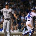 The Mariners Kyle Seager (left) reacts after striking out while Cubs catcher Willson Contreras (right) walks off the field during the seventh inning of a game on Sept. 3, 2019, in Chicago. (AP Photo/Paul Beaty)