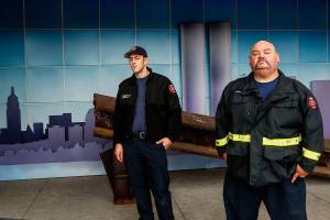 Arlington firefighter Aaron Boede, 30 (left), and acting Capt. Greg Koontz with a steel beam that was recovered from ground zero after the attacks of Sept. 11, 2001. A memorial display at Arlingtons Fire Station 46 is visible from the street and open to the public. (Dan Bates / The Herald)
