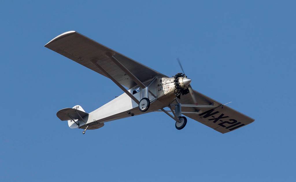 Pilot Ron Fowler takes John Normans replica of the Spirit of St. Louis on its first flight and circles around Arlington Municipal Airport on July 28. Normans replica is considered the most accurate replica made so far. (Andy Bronson / Herald file)
