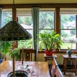 Light pours into the main living area of the 110-year-old Mausshardt home, thanks to banks of windows on multiple sides of the room. (Kevin Clark / The Herald)