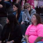 Ali Evans, a friend of Corey Lee, wipes away tears during Snohomish Overdose Preventions A Night to Remember on Thursday in Everett. (Olivia Vanni / The Herald)