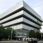 Family and friends who have lost loved ones to OxyContin and opioid overdoses protest in August 2018 outside Purdue Pharma headquarters in Stamford, Conn. OxyContin maker Purdue Pharma made headlines when it reached a landmark settlement with Oklahoma over the toll the opioids crisis has taken on that state. Attempts to do the same in a major federal case in Ohio are proving more difficult. (AP Photo/Jessica Hill, File)