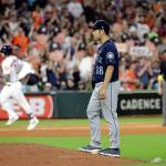 Mariners starting pitcher Yusei Kikuchi (right) stands on the back of the mound after giving up a home run to the Astros Alex Bregman (left) during the sixth inning of a game Sept. 7, 2019, in Houston. (AP Photo/David J. Phillip)