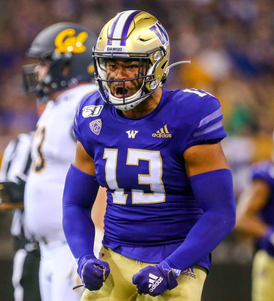 Washingtons Brandon Wellington celebrates a tackle against California Saturday night at Husky Stadium in Seattle on September 7, 2019. (Kevin Clark / The Herald)