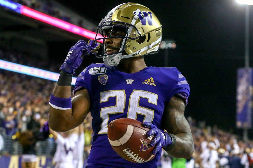 Washingtons Salvon Ahmed is all smiles after his touchdown against California Saturday night at Husky Stadium in Seattle on September 7, 2019.(Kevin Clark / The Herald)