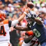 Seattle Seahawks defensive end Jadeveon Clowney rushes Cincinnati Bengals quarterback Andy Dalton on Sunday afternoon at CenturyLink Field in Seattle. The Seahawks won 21-20. (Kevin Clark / The Herald)