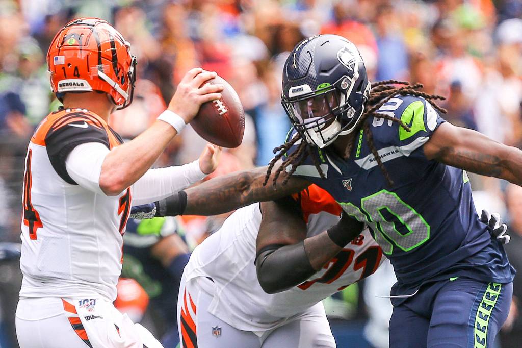 Seattles Jadeveon Clowney rushes Cincinnatis quarterback Andy Dalton at CenturyLink Field Sunday afternoon in Seattle on September 8, 2019. The Seahawks won 21-20. (Kevin Clark / The Herald)