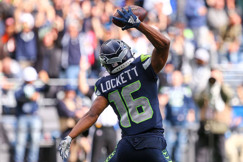 Seattles Tyler Lockett celebrate his touchdown against Cincinnati at CenturyLink Field Sunday afternoon in Seattle on September 8, 2019. The Seahawks won 21-20. (Kevin Clark / The Herald)