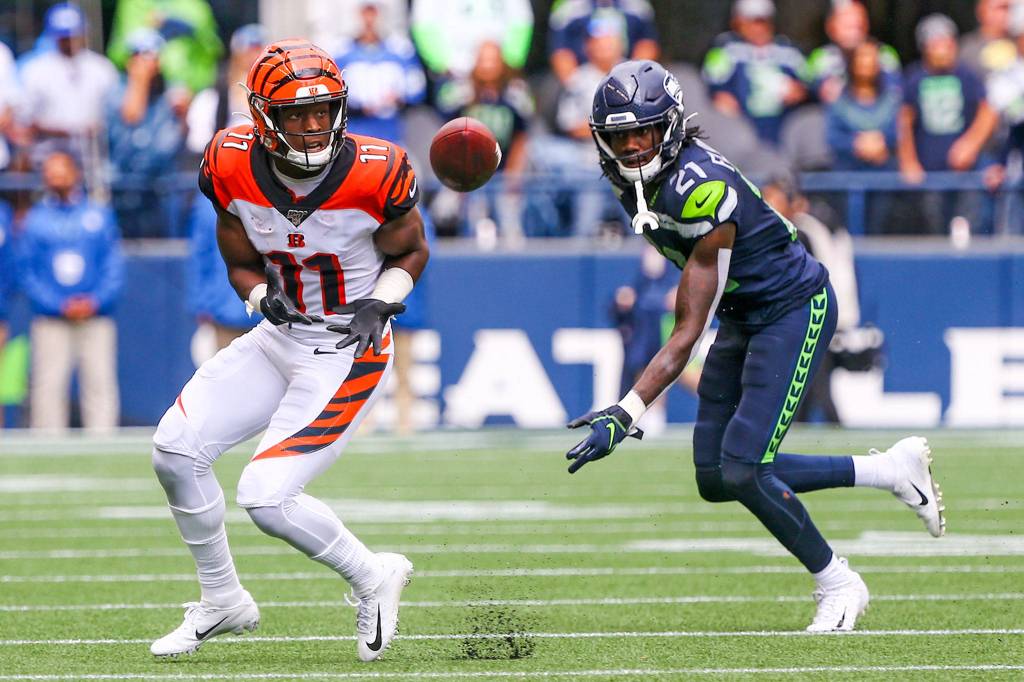 Cincinnatis John Ross III looks to make a catch with Seattles Marquise Blair trailing at CenturyLink Field Sunday afternoon in Seattle on September 8, 2019. The Seahawks won 21-20. (Kevin Clark / The Herald)