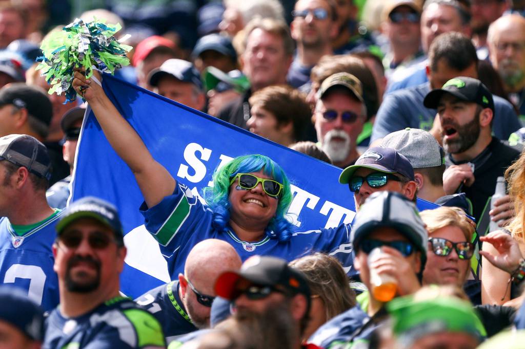 A 12 showing off her spirit at CenturyLink Field Sunday afternoon in Seattle on September 8, 2019.(Kevin Clark / The Herald)