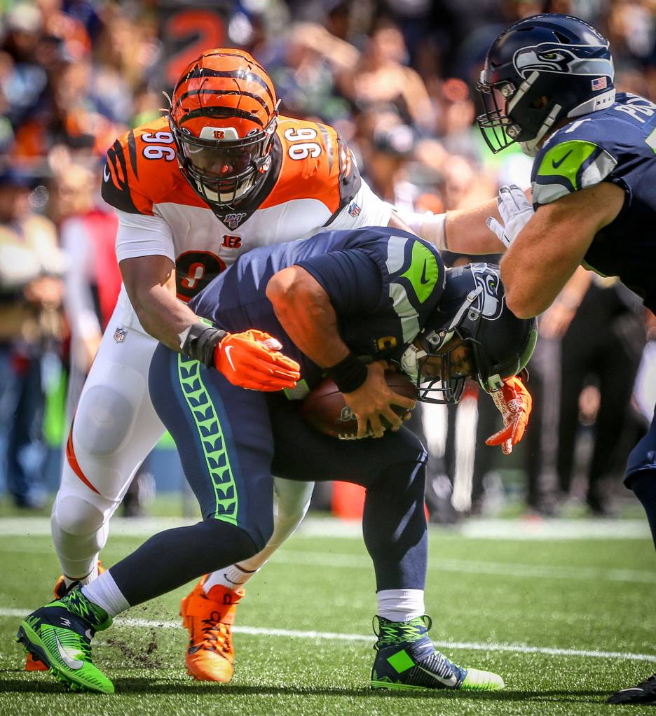 Cincinnatis Carlos Dunlap sacks Seattles Russell Wilson at CenturyLink Field Sunday afternoon in Seattle on September 8, 2019.(Kevin Clark / The Herald)
