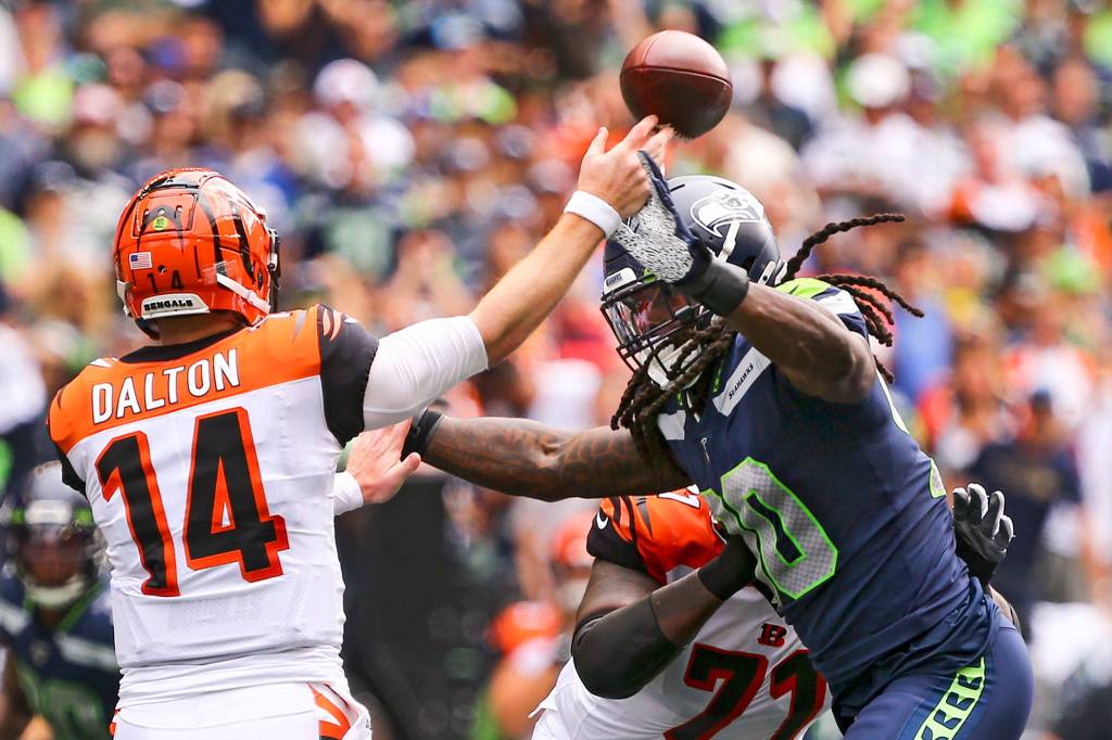 Seattles Jadeveon Clowney rushes Cincinnatis quarterback Andy Dalton at CenturyLink Field Sunday afternoon in Seattle on September 8, 2019. The Seahawks won 21-20. (Kevin Clark / The Herald)