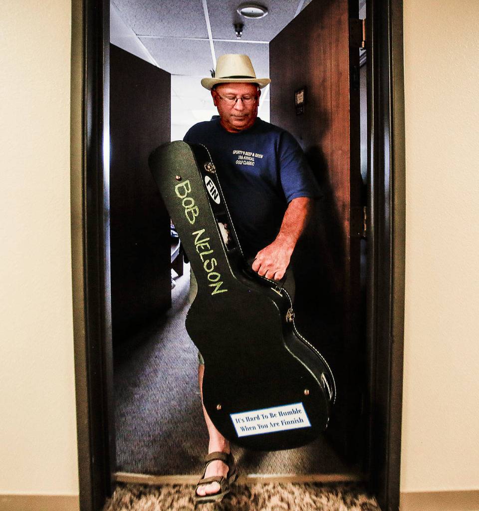 Longtime neighbor of the Nelsons, Phil Flip Mansfield was Bob and Judys friend before they moved into Sunrise View retirement community. On this day, hes going to help carry the gear and see a darned good show. (Dan Bates / The Herald)