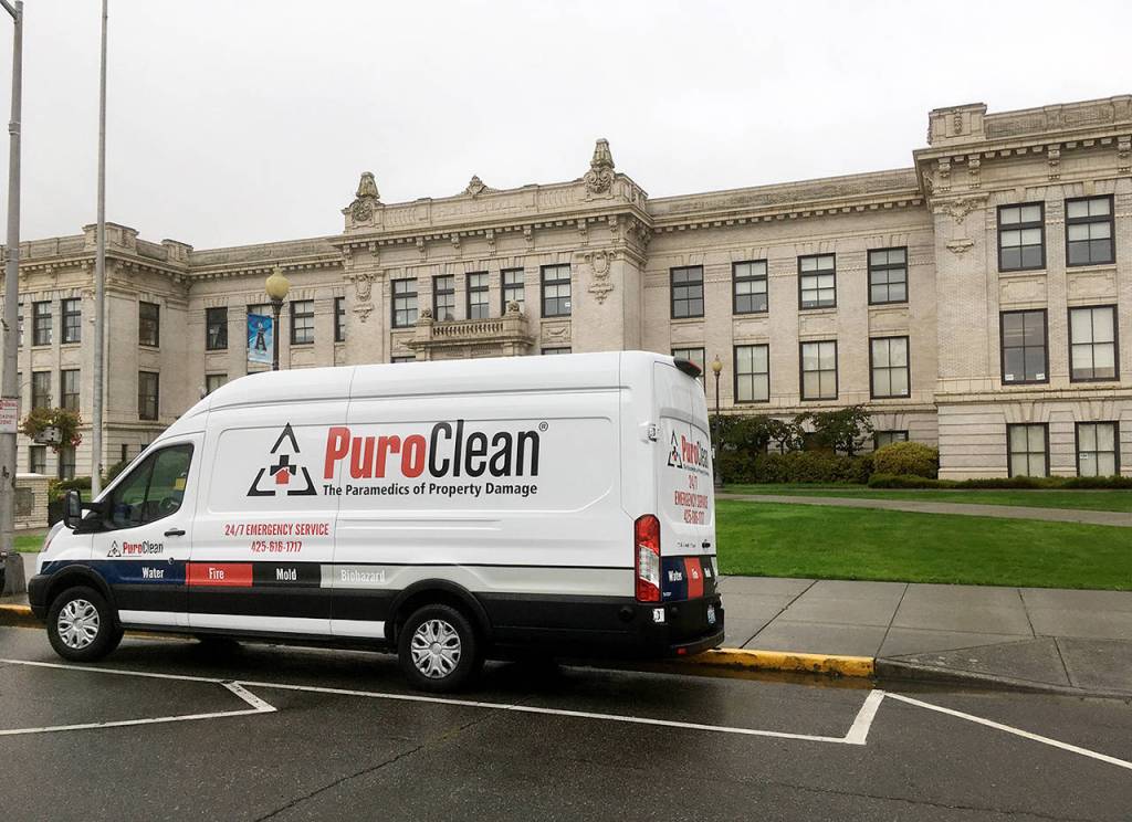 A PuroClean van was parked in front of Everett High School on Tuesday morning. (Sue Misao / The Herald)
