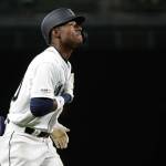 The Mariners Kyle Lewis puts his hand on his heart and looks up as he heads toward home after hitting a solo home run during the fifth inning of the teams game against the Reds on Sept. 10, 2019, in Seattle. (AP Photo/Ted S. Warren)