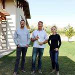 With a 2018 Riesling Ice Wine, winemaker Greg Koenig, center, won the 2019 Idaho Wine Competition for James and Sydney Nederend, left and right, the new owners of Koenig Vineyards in Caldwell. (Koenig Vineyards)