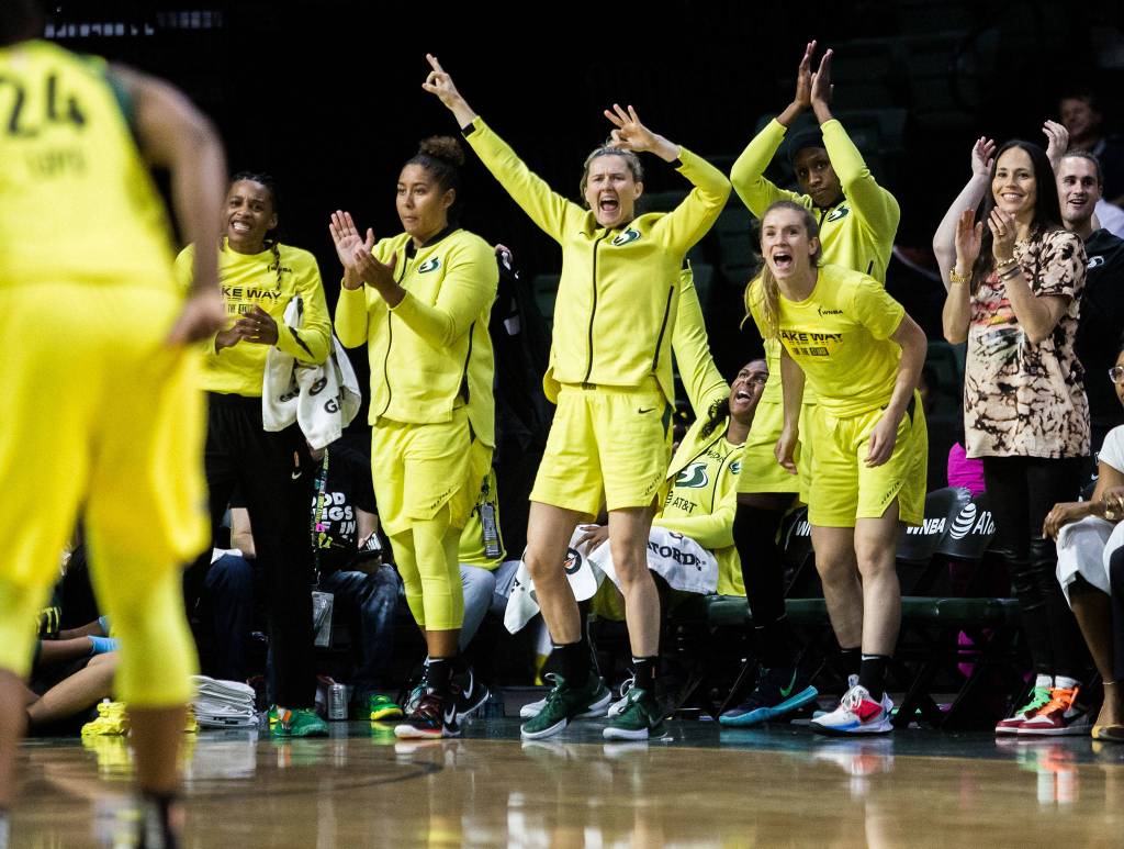The Seattle Storm bench facts to Jewel Lloyd making a three-point shot during the game against the Minnesota Lynx on Wednesday, Sept. 11, 2019 in Everett, Wash. (Olivia Vanni / The Herald)
