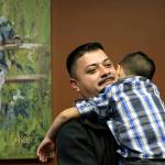 In this 2014 photo, Ignacio Lanuza-Torres holds his son, Isaiah, 4, during a portrait session in Seattle. Lanuza-Torres was nearly deported after a U.S. Immigration and Customs Enforcement lawyer forged a key document in his case. (AP Photo/Elaine Thompson, File)